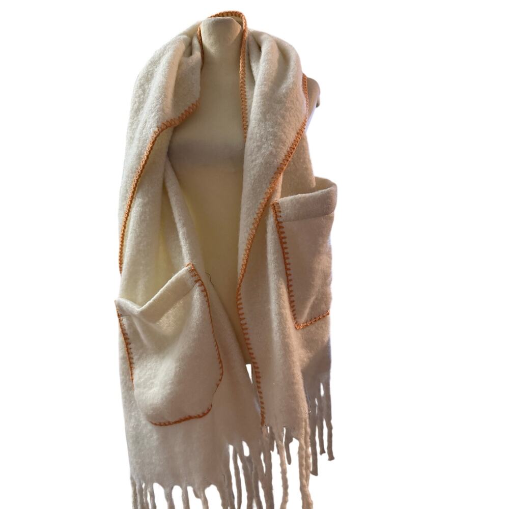 Brit and Company
Cream colored scarf with pockets and orange trim